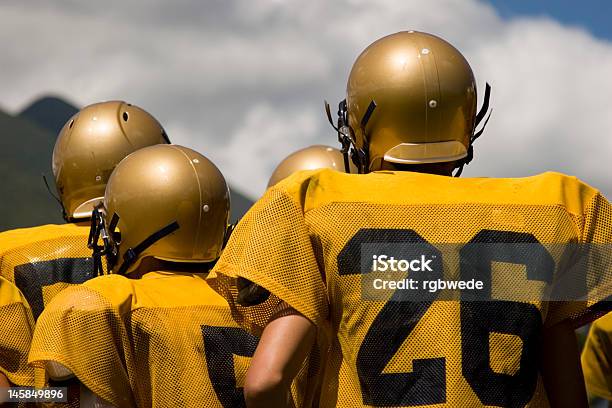 Unity Is Strength Stock Photo - Download Image Now - American Football - Sport, Football Helmet, Gold Colored