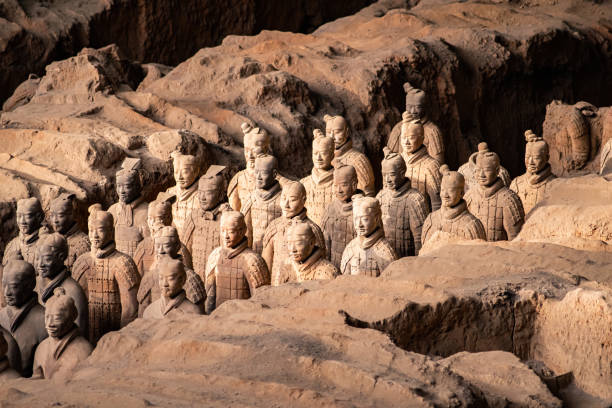 the terracotta army or the "terra cotta warriors and horses" buried in the pits next to the qin shi huang's tomb in 210-209 bc. - army xian china archaeology imagens e fotografias de stock