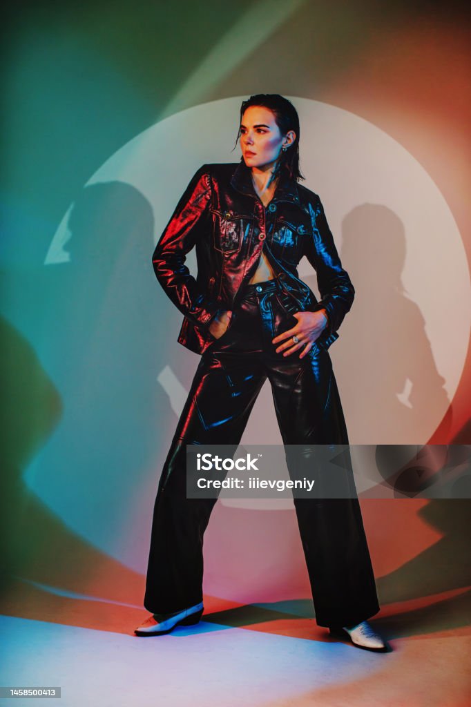 Fashion model in studio Neon light. Suit Fashion Model Stock Photo