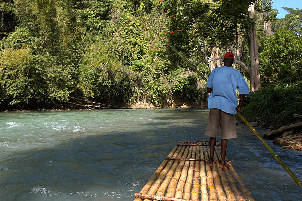 sailing in bamboo raft stock photo