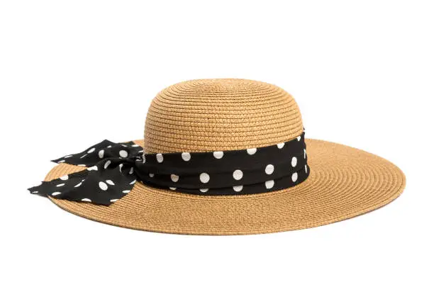 Womens straw hat with a ribbon on a white background.