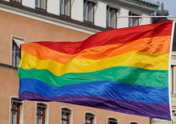 istock a close up of a rainbow flag against building 1458503799