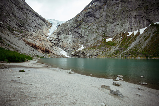 Hiking mountain trek with lake blue water attraction