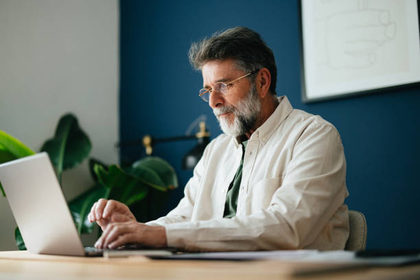 istock Happy Senior Businessman Working At Home 1458504402
