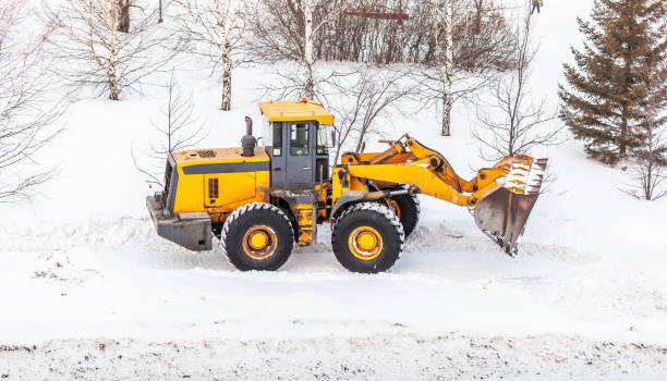 istock Snow clearing. Tractor clears the way after heavy snowfall. 1458504919