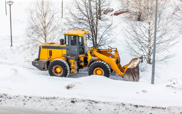 istock Snow clearing. Tractor clears the way after heavy snowfall. 1458505052