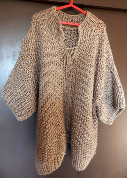 istock beige knitted women's sweater, rough rice pattern, handmade, hobby knitting 1458505725