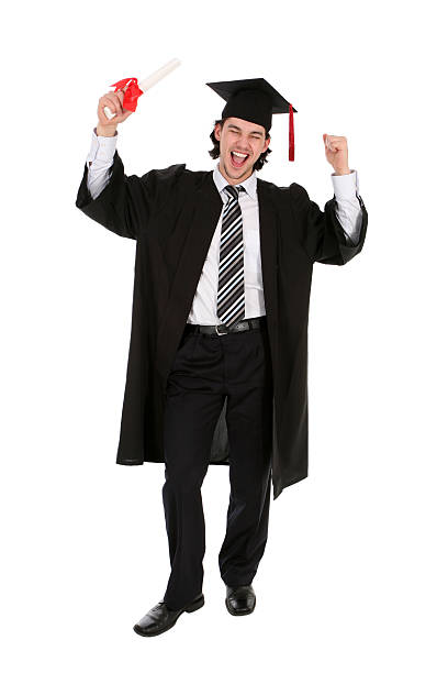 istock Man in graduation robes clenching fists 145850666