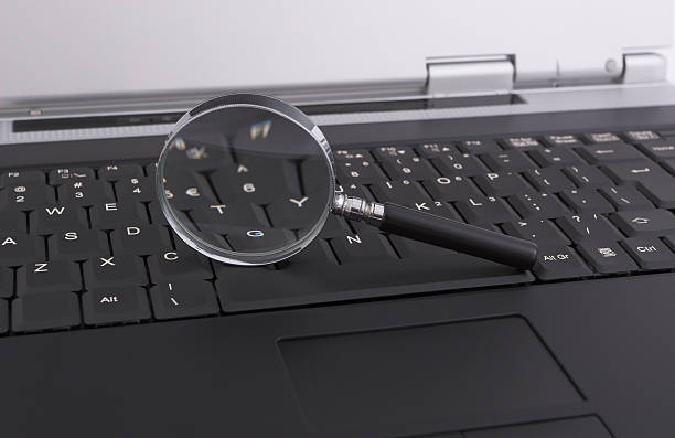 istock Laptop with a magnifying glass - security concept 145850731