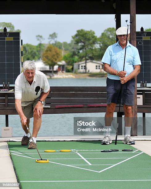 Shuffleboard Opponents Stock Photo - Download Image Now - Shuffleboard, Senior Adult, Playing