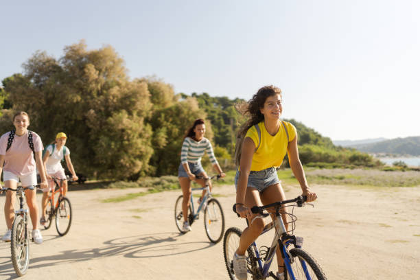 istock High school girls riding bicycles 1458508710