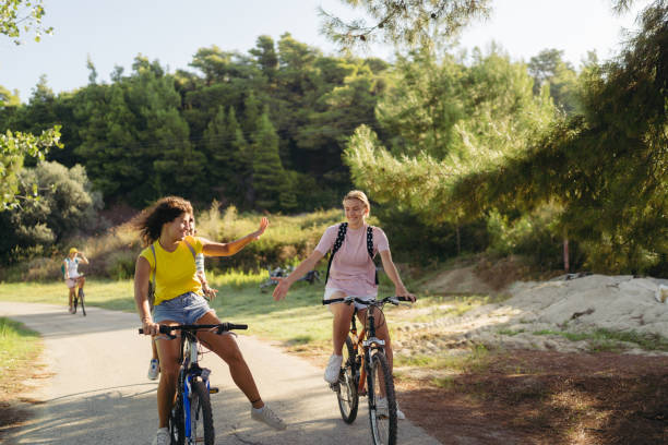 istock High school girls riding bicycles 1458508748