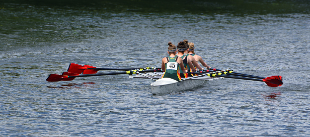 St Neots, Cambridgeshire, England - July 23, 2022: Ladies Fours Sculling Team Rowing on River.
