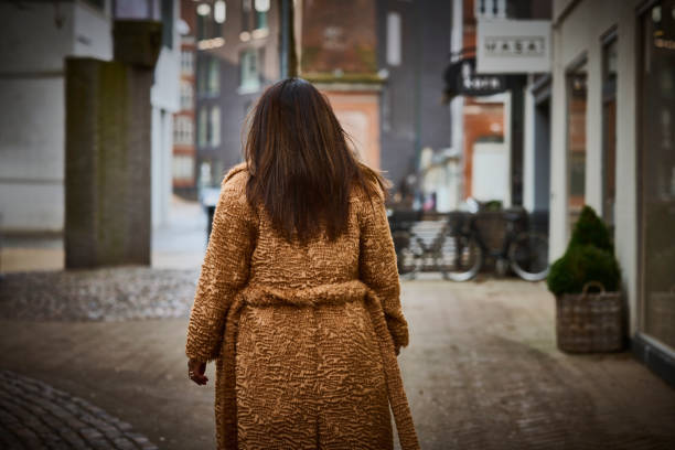 istock Woman outdoors wearing coat 1458510289