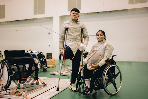 Portrait of A male and female fencers preparing for a walking exercise.