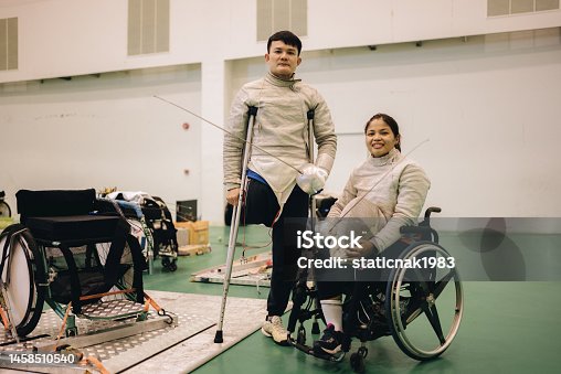 istock Portrait of A male and female fencers preparing for a walking exercise. 1458510540