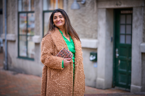 Portrait of Tamil ethnic woman, Portrait in street and focus on foreground model looking away