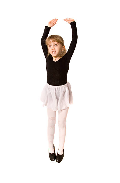 Little girl jumping hight isolated stock photo