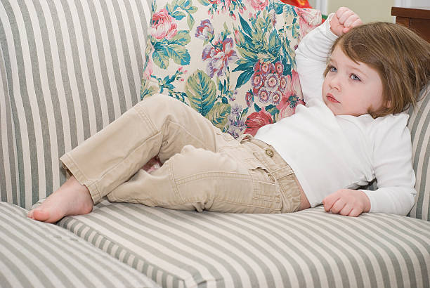 istock Pretty girl on a couch 145851281