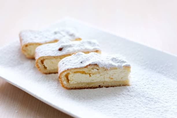 istock cheesecake curd strudel sliced on white plate sprinkled with powdered sugar dough is separated from curd creating drawing place for text advertising benefits of cooking show recipes restaurant serving 1458512928