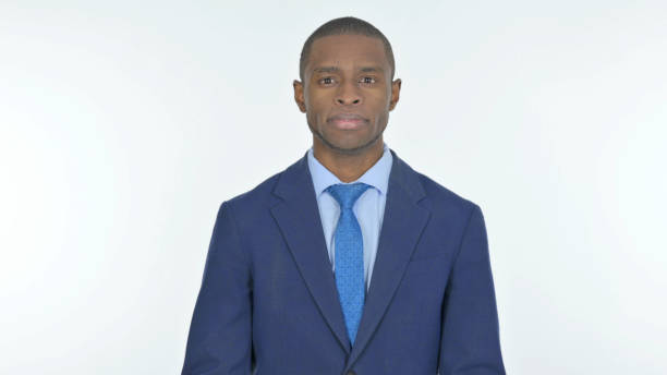 istock Serious African Businessman on White Background 1458513297