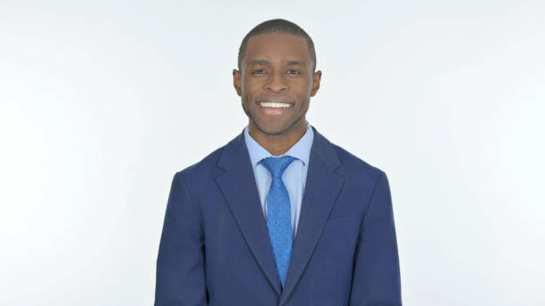 istock Smiling African Businessman on White Background 1458513316