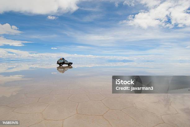 Mirror Landscape Of Jeep In Salt Lake Salar De Uyuni Bolivia Stock Photo - Download Image Now