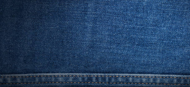 istock texture of blue jeans denim fabric with seam background 1458514548