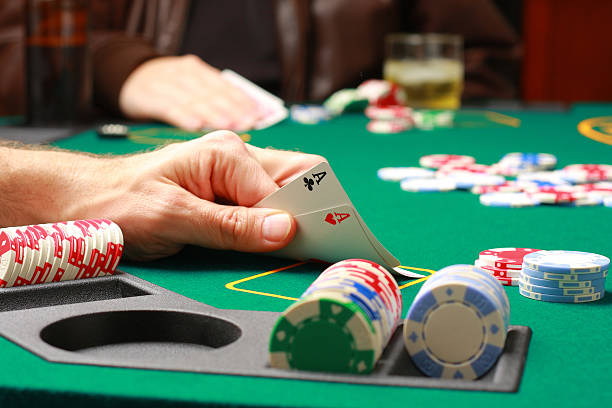 istock Man checking cards during poker game 145851634