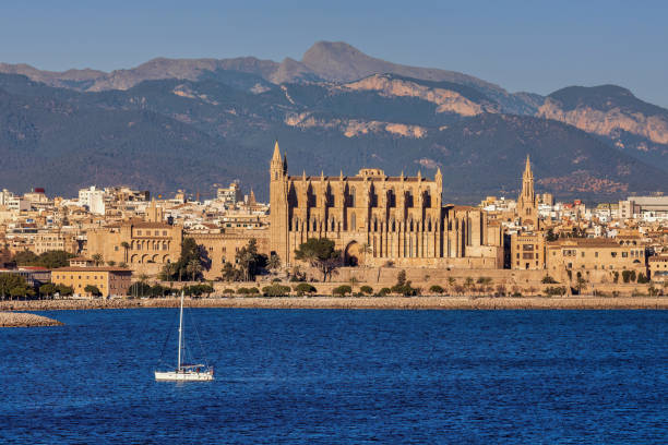 Panoramic view of Palma de Majorca with small sail boat in the front, Mallorca Balearic Islands, Mediterranean Sea. Spain stock photo