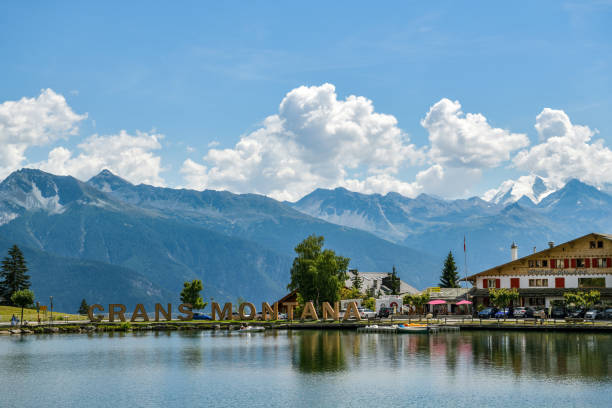 Big letters near lake in Crans Montana in Switzerland Crans-Montana, Switzerland - August 10, 2020: Big letters near lake in Crans Montana in Switzerland during August 2020 crans montana stock pictures, royalty-free photos & images
