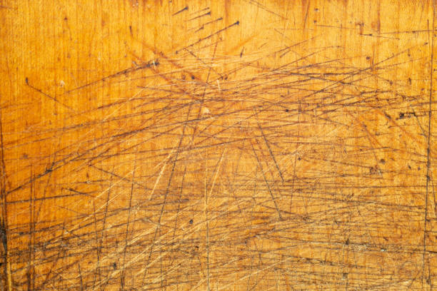 istock Overused chopping board with cuts and scratches 1458519106