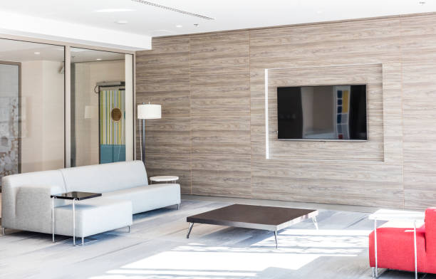 istock Modern Waiting Room With  Sofa, Coffee Table and Tv 1458519537