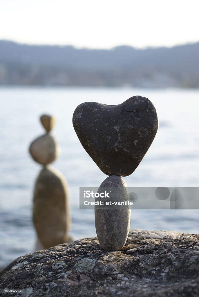 stone heart stone heart standing on the another stone Abstract Stock Photo