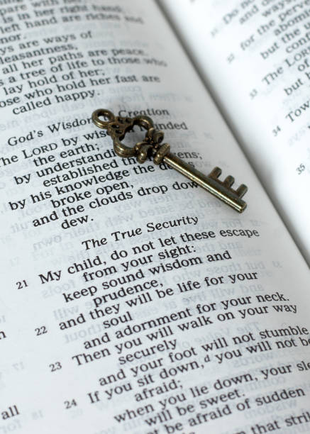 istock True security verses in open holy bible book and ancient key, a closeup 1458523328