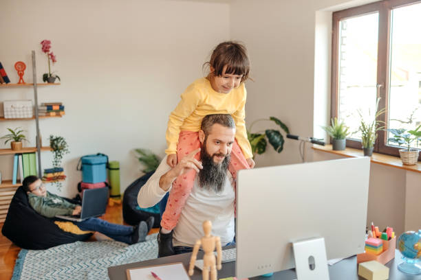 Home office with two kids stock photo