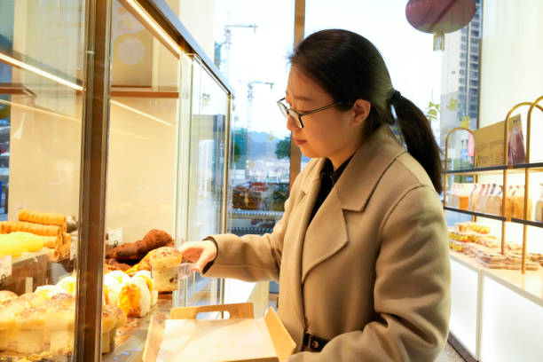 istock The woman is buying bread 1458524148