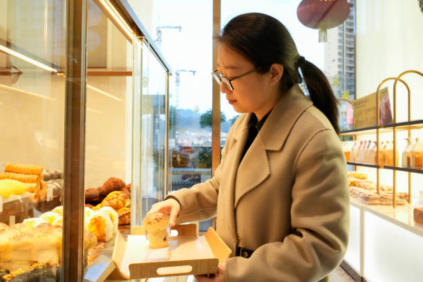 istock The woman is buying bread 1458524180