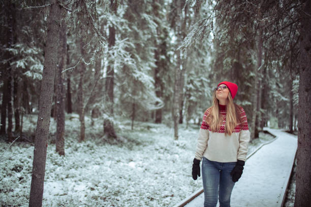 istock A cheerful woman walks along a path through the forest 1458524829