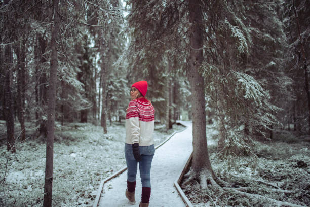 istock A woman walks along a path through the forest 1458524833