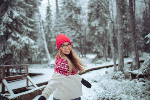 istock Smiling woman walking through the forest 1458524836