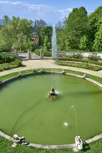 Turin, Italy - April 19, 2019: The main fountain of the park of the Queen's Villa, royal residence on the hill of the city