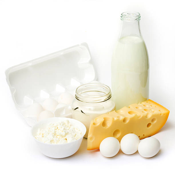 istock Fresh eggs, milk, and cheese on a white background 145852622