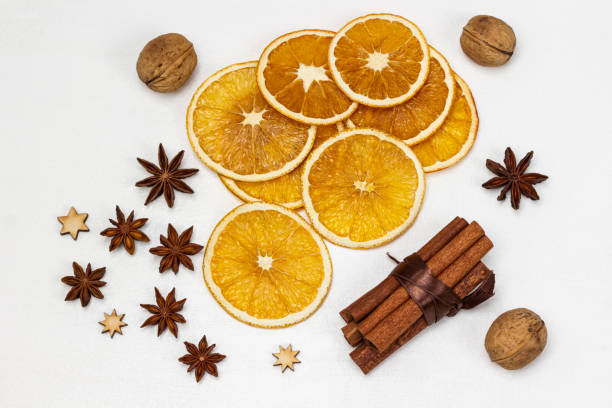 istock Bundle of cinnamon sticks. Orange chips and star anise. 1458526938