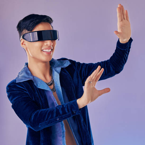 istock VR in digital gaming, asian man with future IT technology and UI software in 3d cyber application. Creative innovation for happy gamer, futuristic metaverse for vision and virtual reality ux design 1458527742