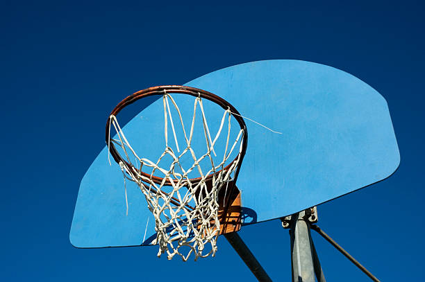 istock Worn Basketball Hoop, Blue Backboard and sky 145852994