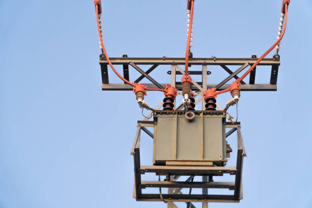 istock High voltage electrical transformer, against blue sky. 1458530225