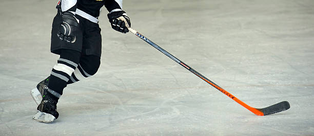 istock Hockey player and stick 145853195