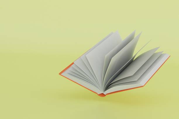 istock love of reading books. an open book on a yellow background. 3D render 1458534093