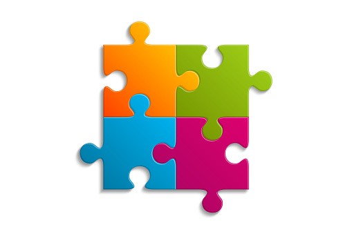 Multi colored jigsaw puzzle connecting together on white background. Business success partnership or teamwork concept.
